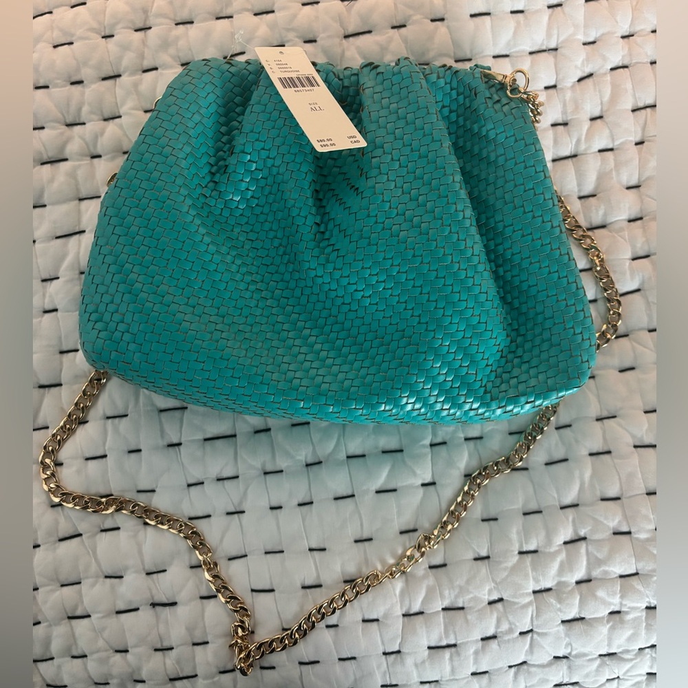 The Frankie Faux Leather Clutch Bag from Anthropologie